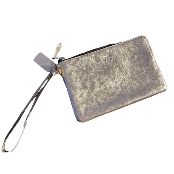 Coach Handbags - NWOT COACH -silver Wristlet. New never used.